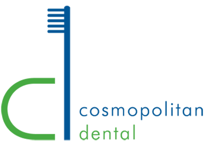 The image features a logo with a stylized toothbrush on the left side, connected by a curved line to the letters CD in bold blue font, followed by the word COSMOPOLITAN in uppercase letters beneath it. To the right of CD, there is a graphic element resembling a brushstroke or paint splatter in green and white colors. The background is plain and does not provide additional context about the nature of the business or service represented by the logo.