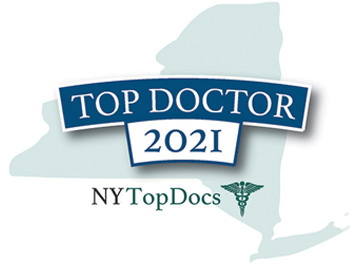 The image features a logo with text elements, predominantly displaying the words TOP DOCTOR 2021 along with an emblem resembling a shield with a map of New York State at its center and a banner beneath it indicating NYTOPDOCS. The design is professional and suggests recognition or accreditation within the medical field for the year 2021.